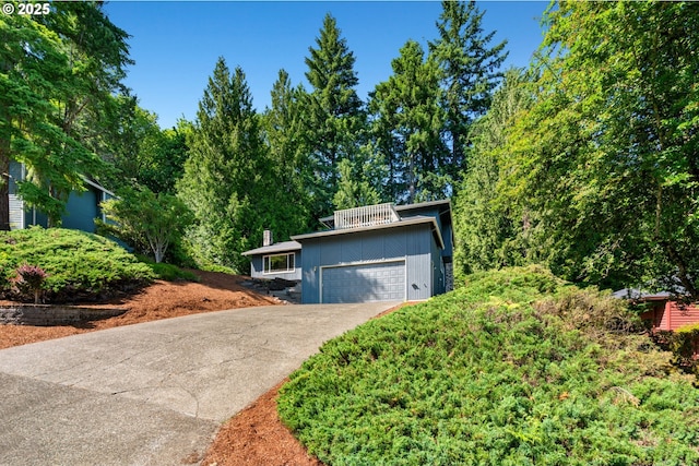 2845 SW Raleighview Dr, Portland, OR 97225 - mid-century inspired home with driveway and a garage
