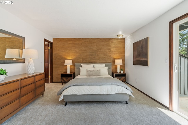 2845 SW Raleighview Dr, Portland, OR 97225 - bedroom featuring an accent wall, light carpet, and access to outside