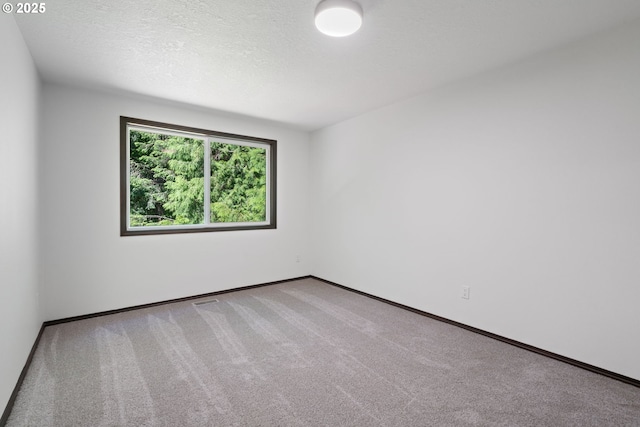 2845 SW Raleighview Dr, Portland, OR 97225 - carpeted empty room featuring baseboards and a textured ceiling