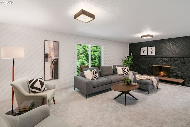 2845 SW Raleighview Dr, Portland, OR 97225 - carpeted living room featuring a stone fireplace and a textured ceiling