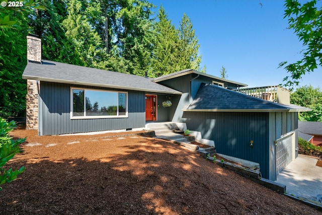 2845 SW Raleighview Dr, Portland, OR 97225 - view of front of home featuring a chimney and a shingled roof