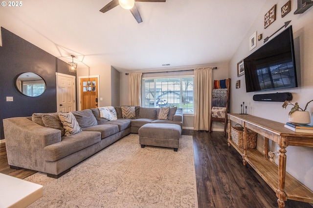 living area with ceiling fan, visible vents, wood finished floors, lofted ceiling, and baseboards