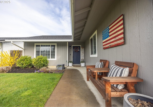 doorway to property with a lawn