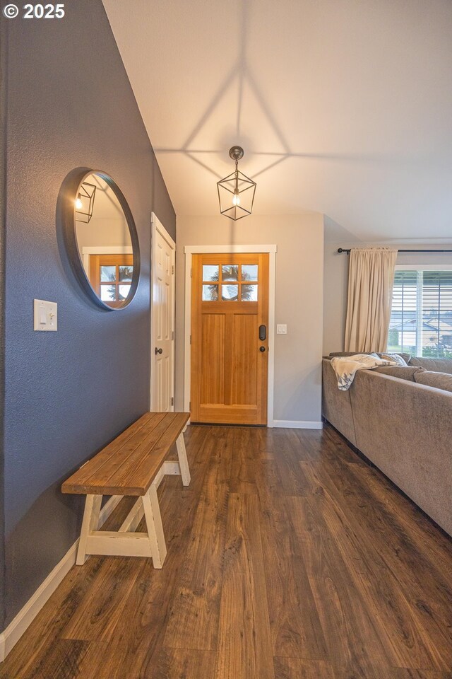 entryway featuring dark wood-style floors and baseboards