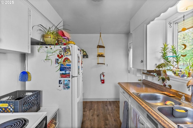 520 NW 10th St, Corvallis, OR 97330 - kitchen with freestanding refrigerator, baseboards, white cabinetry, a sink, and dark wood finished floors