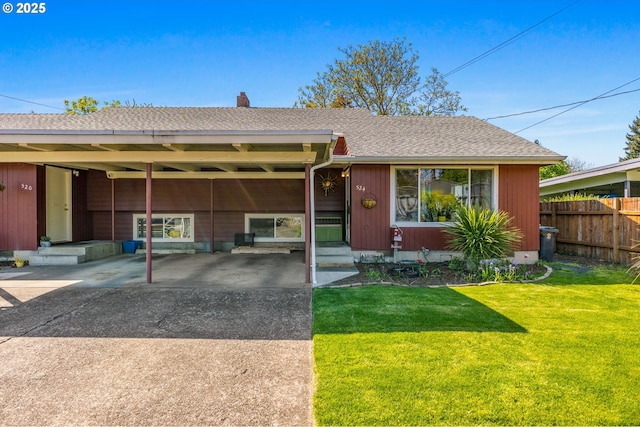 520 NW 10th St, Corvallis, OR 97330 - view of front of house featuring a front lawn, fence, driveway, and an attached carport