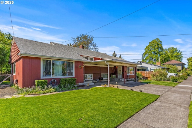 520 NW 10th St, Corvallis, OR 97330 - view of front of house featuring a porch, fence, a shingled roof, and a front yard