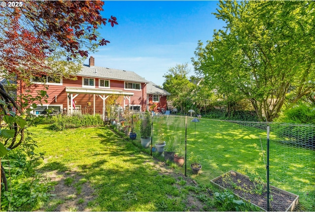 520 NW 10th St, Corvallis, OR 97330 - view of yard with fence, a pergola, and a vegetable garden
