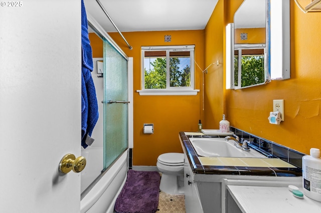 520 NW 10th St, Corvallis, OR 97330 - full bathroom with vanity, shower / bath combination with glass door, a healthy amount of sunlight, and toilet