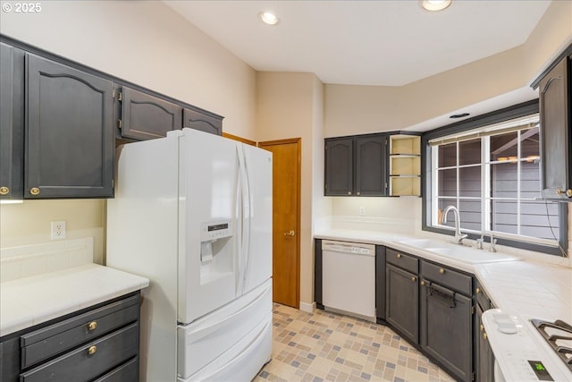 257 SW Nancy Cir, Gresham, OR 97030 - kitchen with white appliances, recessed lighting, open shelves, and tile counters