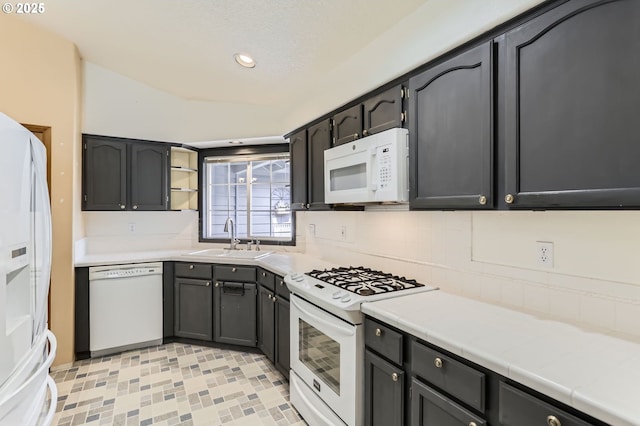 257 SW Nancy Cir, Gresham, OR 97030 - kitchen featuring white appliances, recessed lighting, tile counters, open shelves, and backsplash