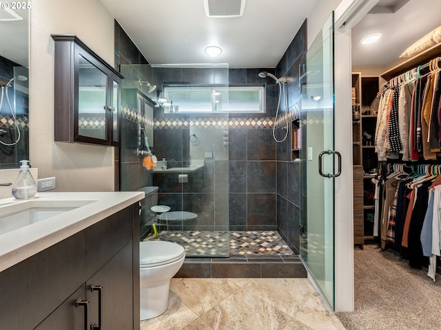 24125 Butteville Rd NE, Aurora, OR 97002 - full bathroom with vanity, toilet, a stall shower, and a walk in closet