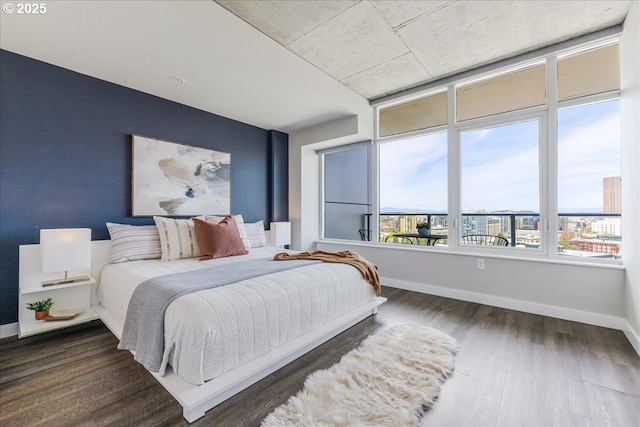 bedroom featuring dark wood finished floors