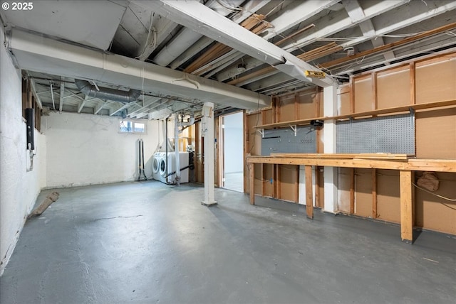 1235 N Farragut St, Portland, OR 97217 - basement with separate washer and dryer, a workshop area, and electric panel