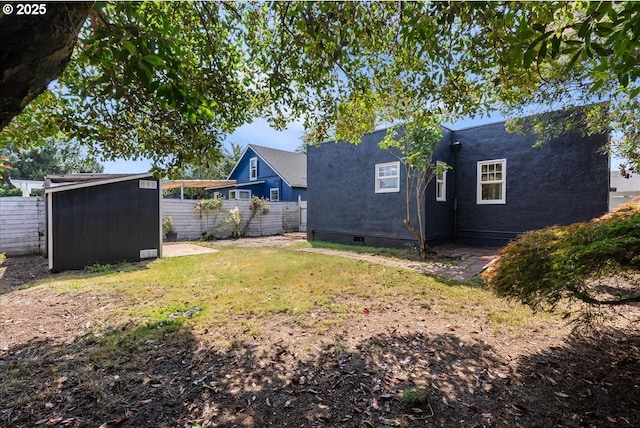 1235 N Farragut St, Portland, OR 97217 - fenced backyard featuring a shed