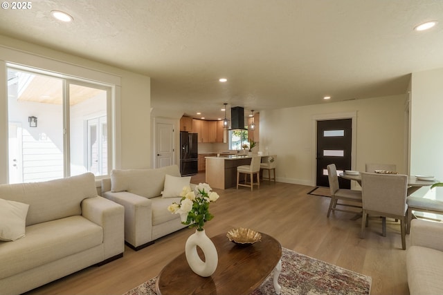 535 E St, Independence, OR 97351 - living area with light wood-type flooring, baseboards, and recessed lighting
