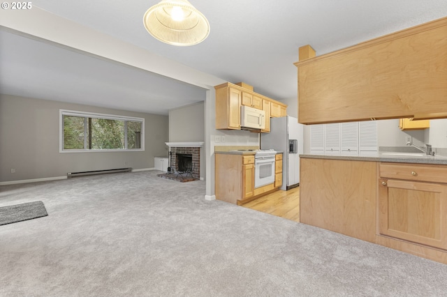 kitchen with light brown cabinets, white appliances, a brick fireplace, and sink