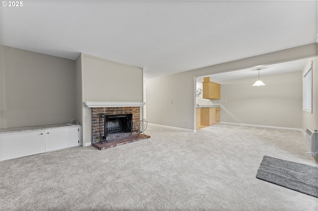 unfurnished living room featuring a fireplace and light colored carpet