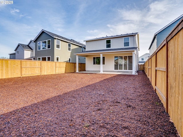 rear view of house with a patio area