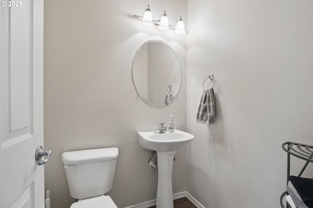 bathroom featuring toilet