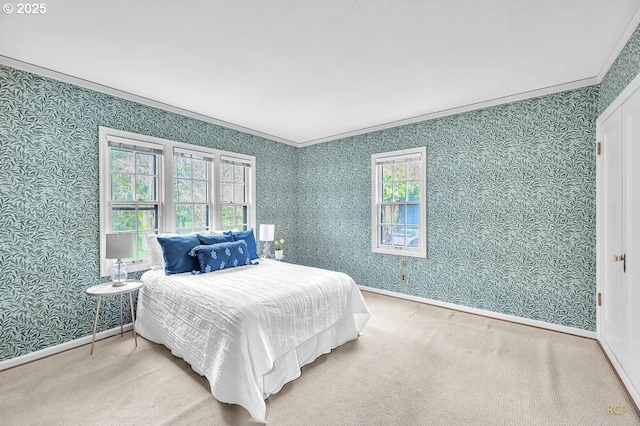 carpeted bedroom featuring wallpapered walls, crown molding, and baseboards