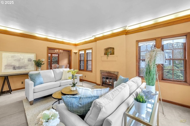 living room with a notable chandelier, carpet flooring, baseboards, and ornamental molding