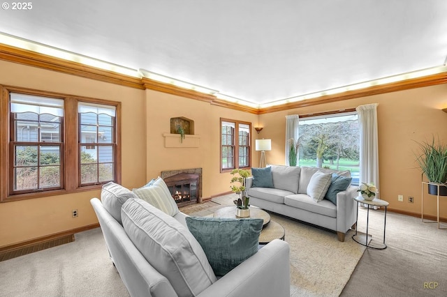 living area featuring light colored carpet, crown molding, and baseboards