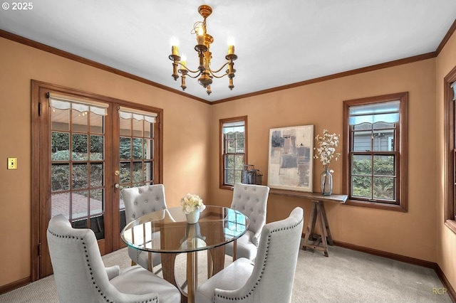 dining room with a chandelier, light carpet, crown molding, and baseboards