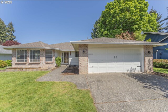 single story home featuring brick siding, a front lawn, an attached garage, and concrete driveway