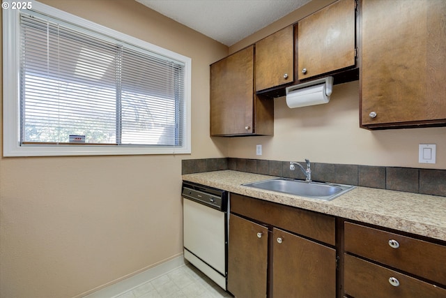 kitchen with white dishwasher and sink