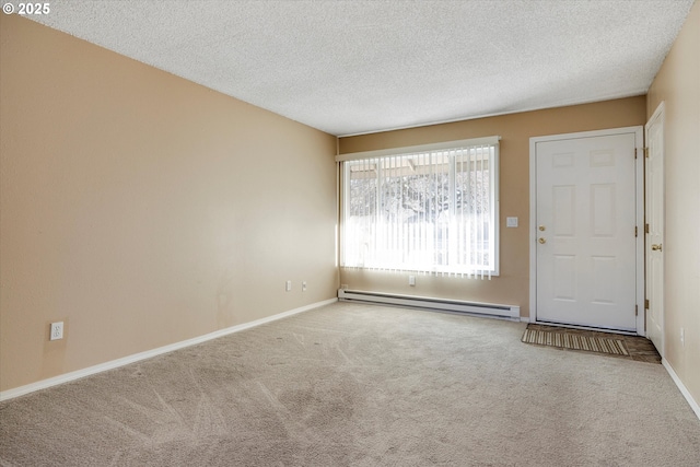 interior space with carpet floors, a textured ceiling, and baseboard heating