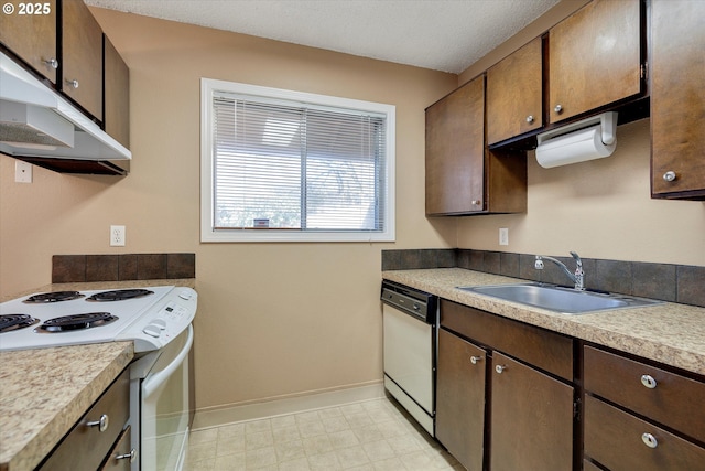 kitchen featuring sink and white appliances