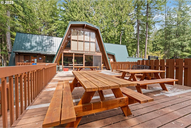 deck with outdoor dining area
