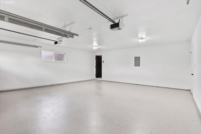 garage featuring a garage door opener and electric panel