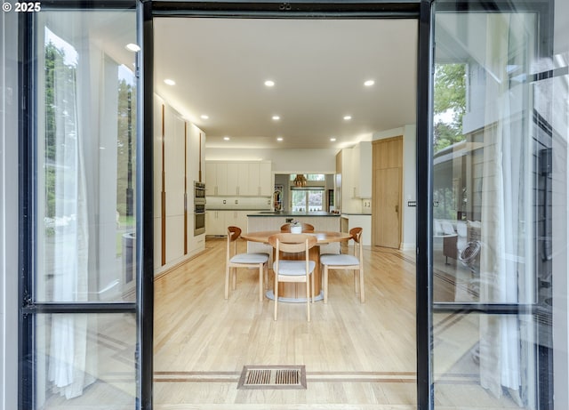 1564 Regency Dr, Eugene, OR 97401 - dining space featuring light wood-style flooring and recessed lighting