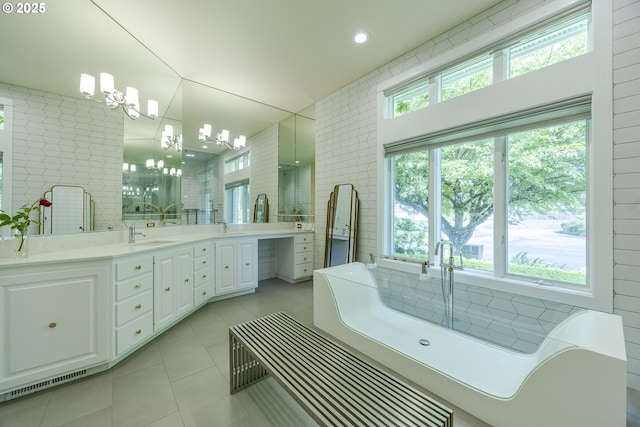 1564 Regency Dr, Eugene, OR 97401 - bathroom featuring tile patterned floors, double vanity, a soaking tub, healthy amount of natural light, and recessed lighting