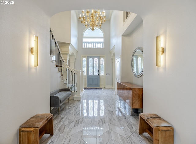 1564 Regency Dr, Eugene, OR 97401 - foyer with a chandelier, a towering ceiling, light marble finish flooring, stairway, and arched walkways