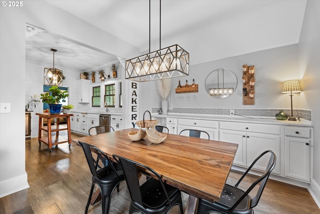 dining space featuring dark wood-type flooring