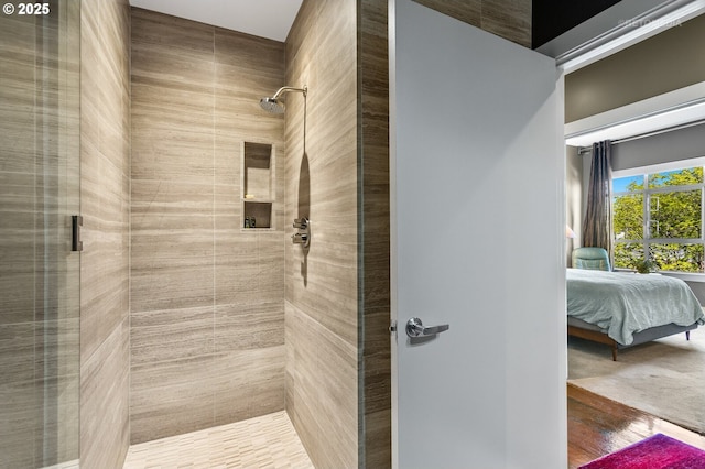 bathroom with tiled shower