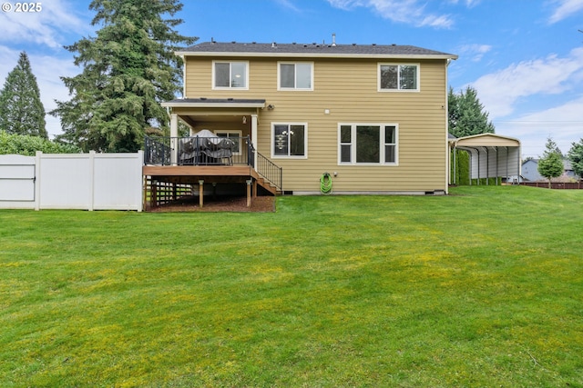 rear view of house with fence, a yard, a wooden deck, crawl space, and a carport