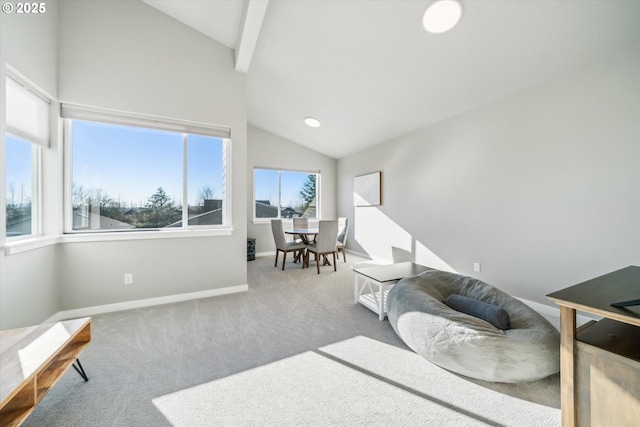 living room with lofted ceiling with beams and carpet