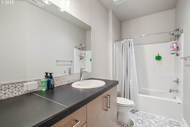 full bathroom with vanity, decorative backsplash, toilet, and shower / bath combo with shower curtain