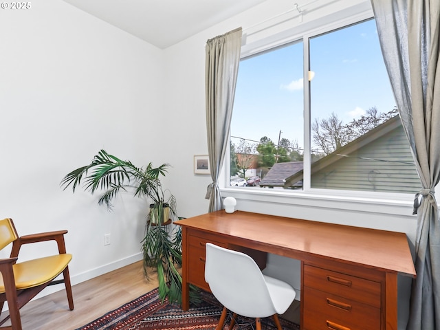 office area with light hardwood / wood-style flooring