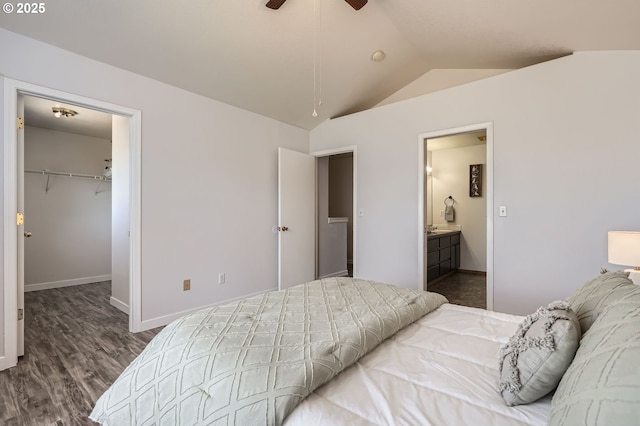 7217 NE 130th Ave, Vancouver, WA 98682 - bedroom featuring lofted ceiling, wood finished floors, a spacious closet, baseboards, and ensuite bathroom