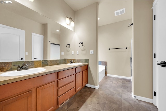 bathroom featuring vanity and a tub to relax in