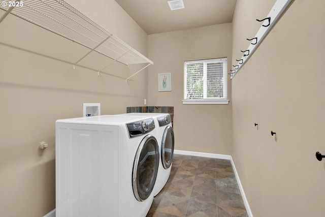 laundry room with washing machine and dryer