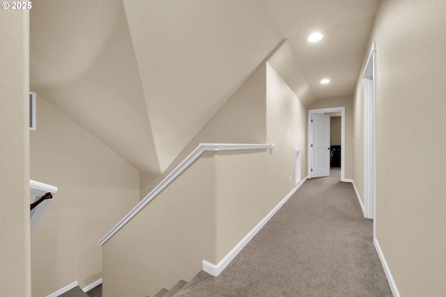 hall featuring light colored carpet