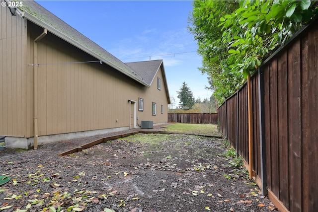 view of side of home featuring central AC unit