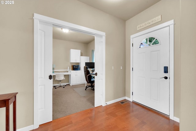 foyer with hardwood / wood-style flooring