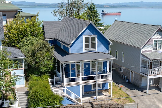 842 Irving Ave, Astoria, OR 97103 - view of front of property with stairway, a porch, and a water and mountain view